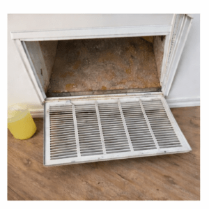 vent opened to show dust and debris inside ductwork before cleaning